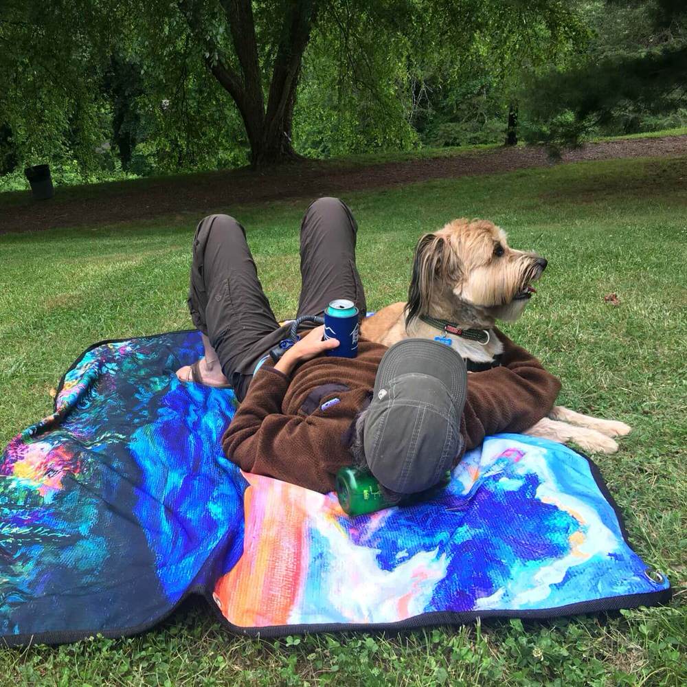 Picnic mat in park with dog